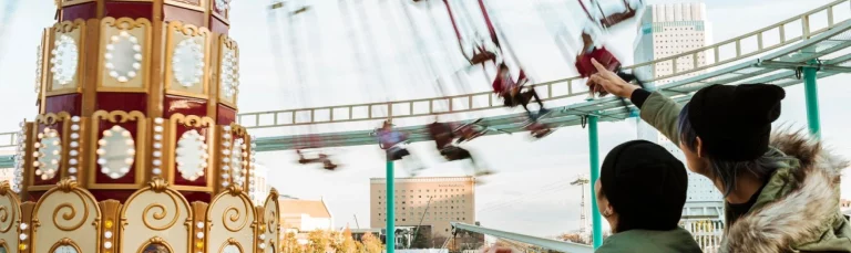 A cozy family-friendly hotel near Alton Towers Resort with theme park in the background, hotels close to alton towers